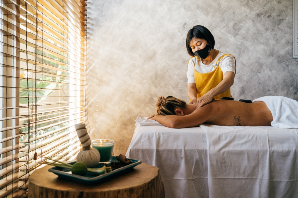 An Asian massage therapist