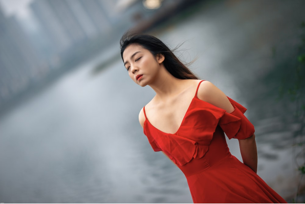 A Chinese woman relaxing by the river