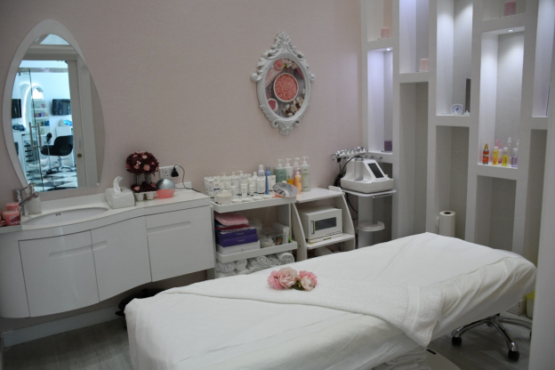  Massage room featuring massage table and other tools of trade