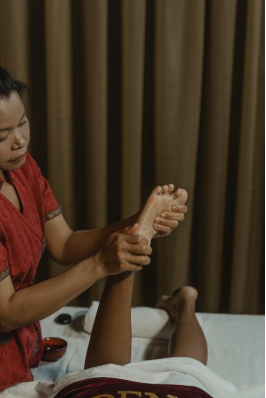  an Asian woman giving a massage 