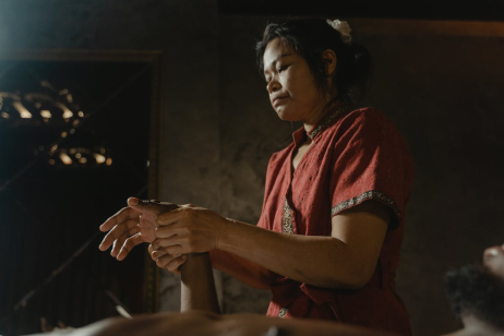 a woman giving a hand massage 