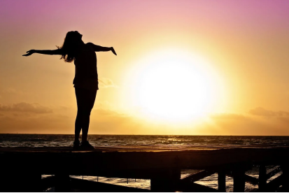 An image of a woman’s silhouette during the golden hour