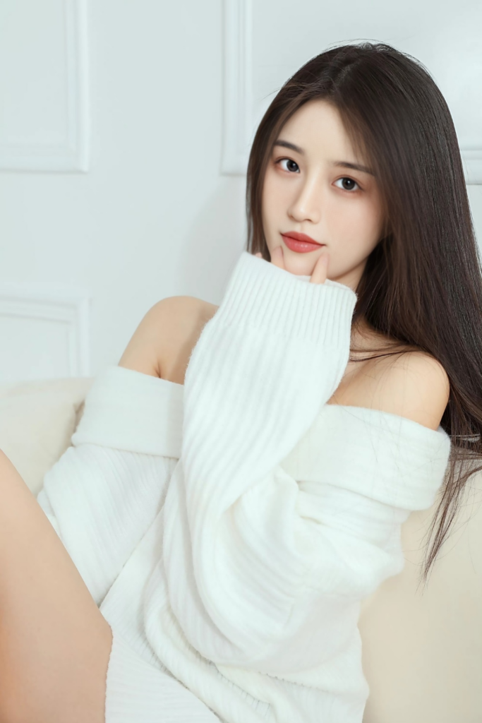 A girl wearing white sweater
