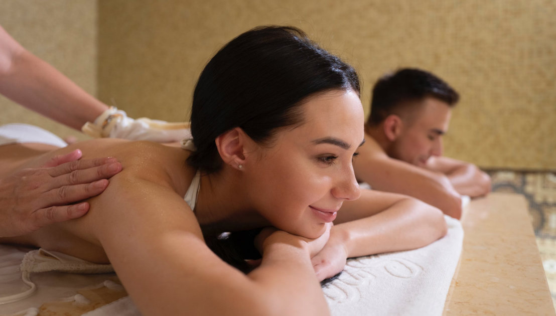Couple getting massage in a hotel room.